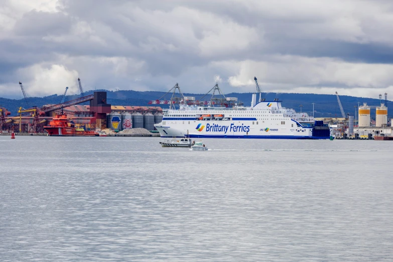 a large blue and white boat floating in the water