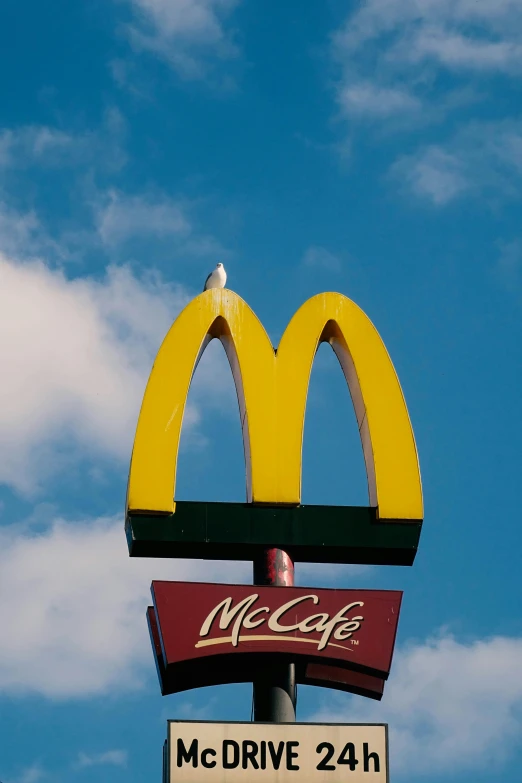 the mcdonalds sign is painted in yellow and red