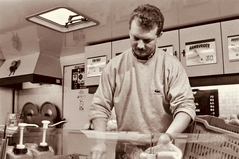 a man is standing in a store that sells  dogs