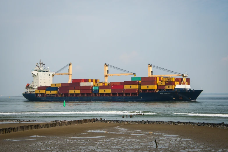 a ship passing by some water in the ocean