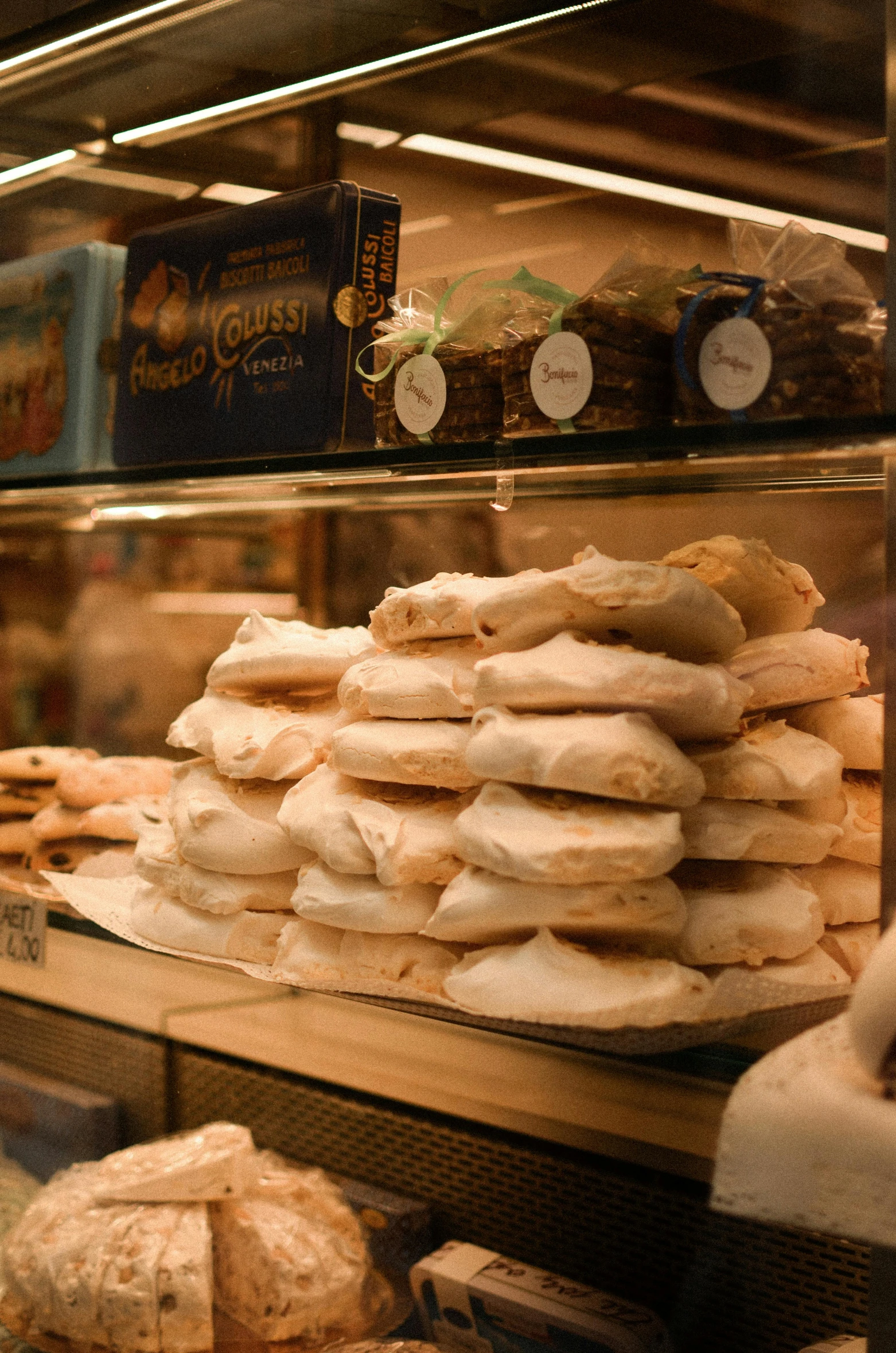 a display case of baked goods and cookies