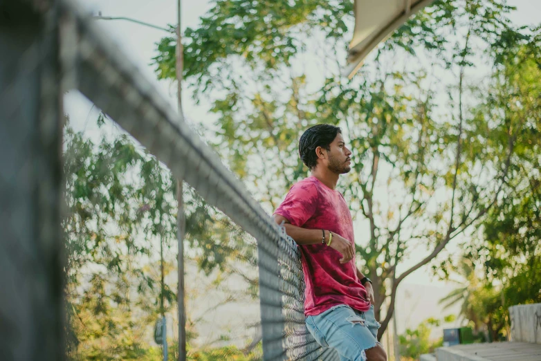 a man standing on a tennis court holding a racquet