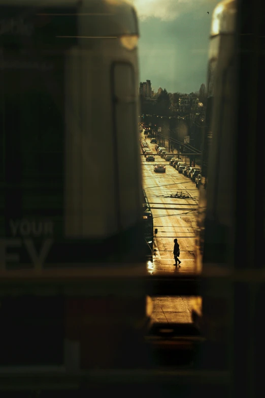 people standing in the street from behind some buildings