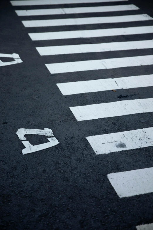two markings painted in the street showing crosswalks