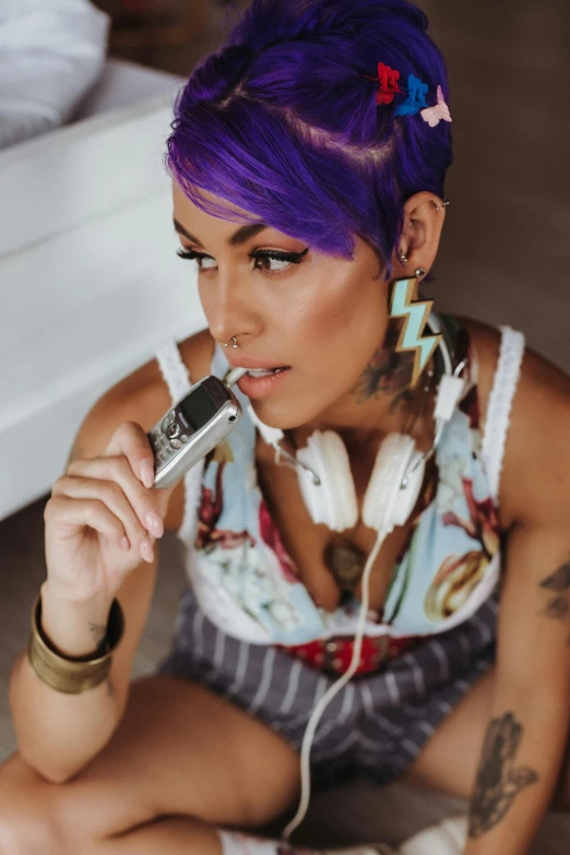 the woman has purple hair and is smoking