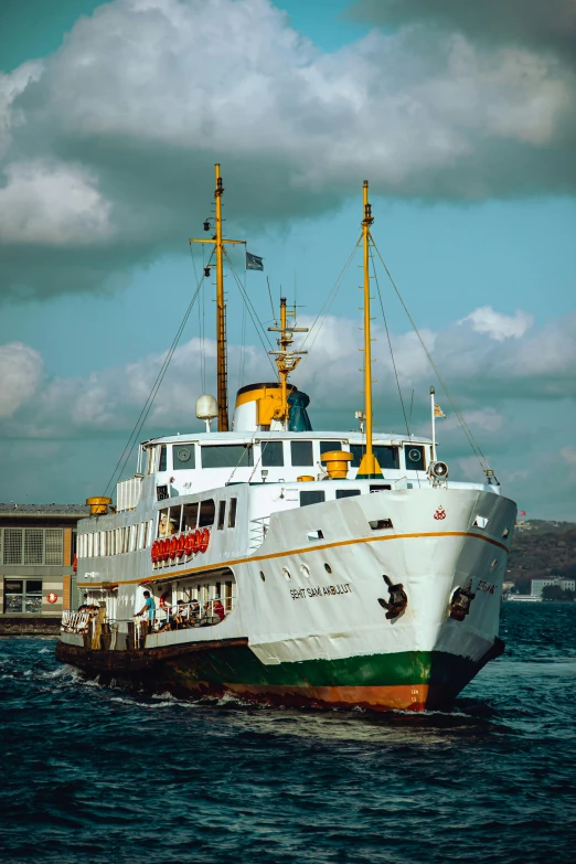 a large boat sailing near a dock in the water