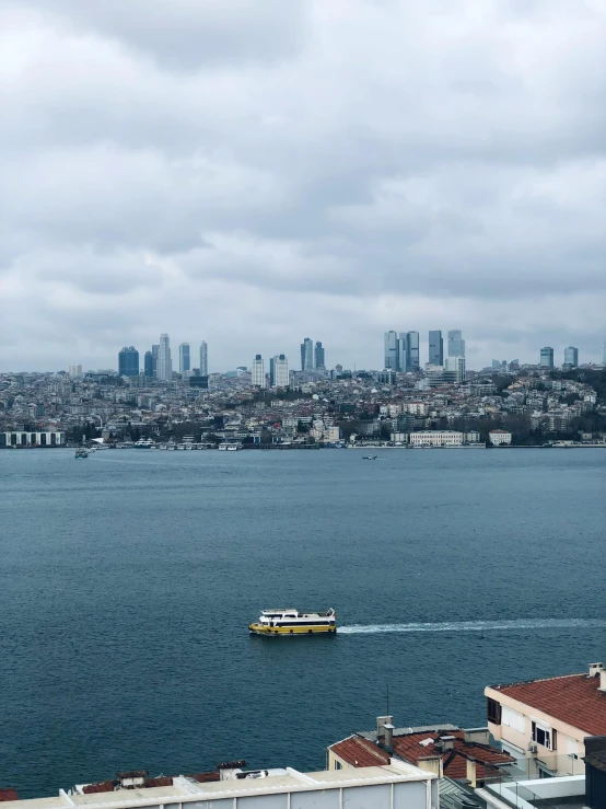 a boat is traveling in a large body of water