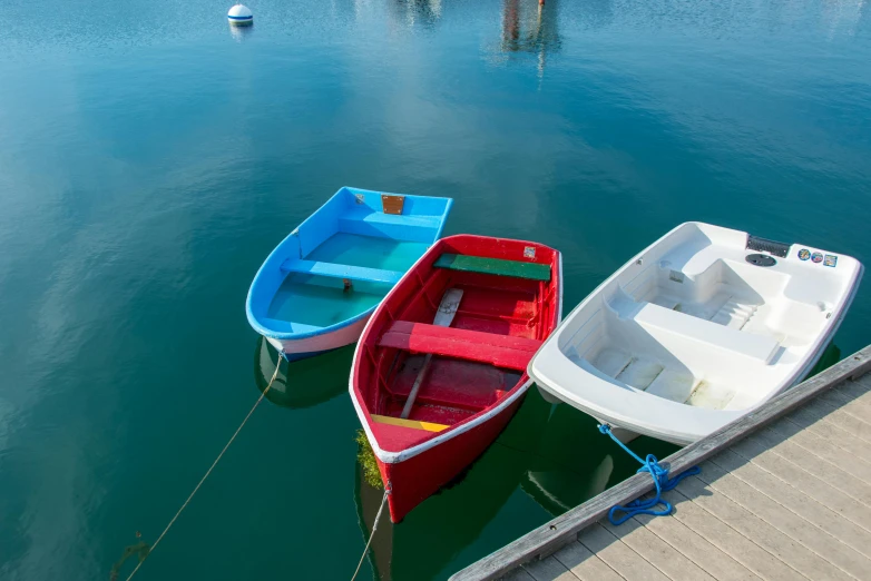 a couple of small boats floating on top of water