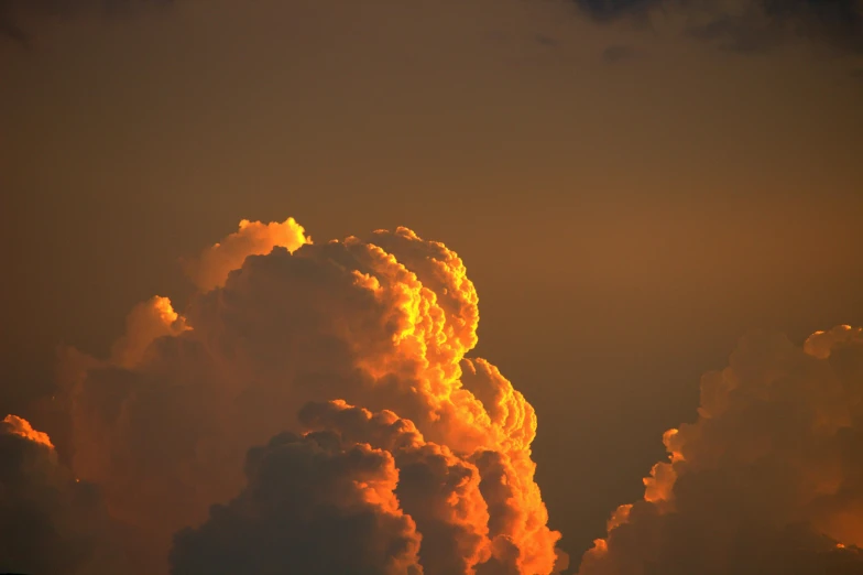 a large cloud is in the sky at night