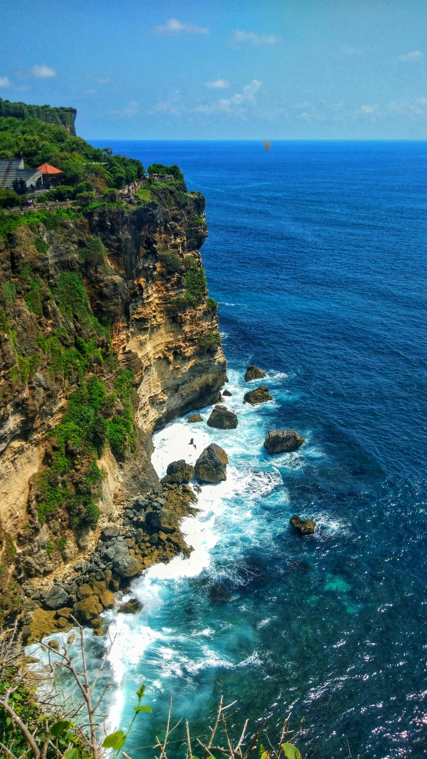 a hill on the side of a hill overlooking the ocean