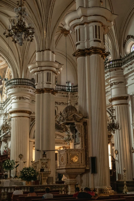 the inside of an ornate building with tall ceilings