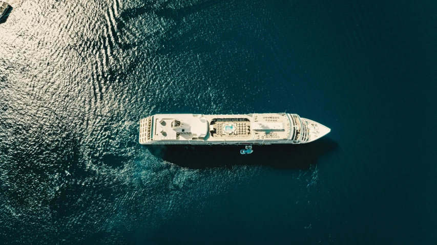 there is a boat in the water near rocks