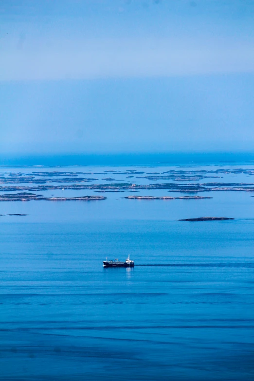 an ocean with boats floating on the surface