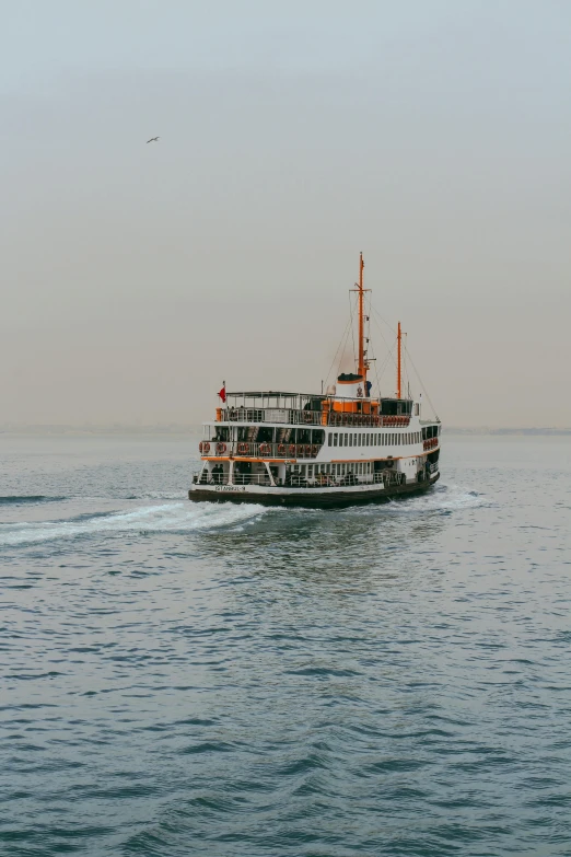 the ferry boat is heading out to sea