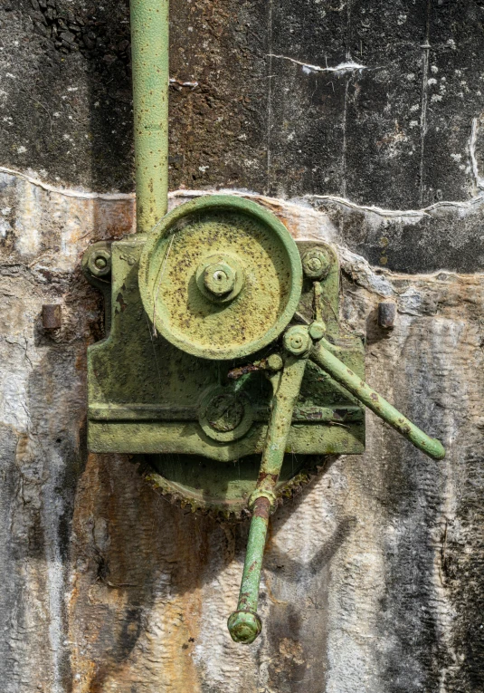 old iron lock and wheel on a wall