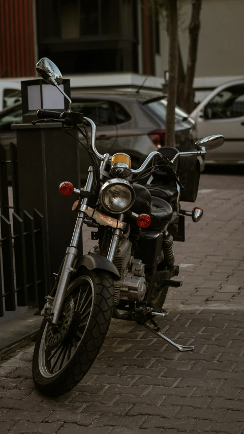 a motorcycle sitting parked on the side of a street