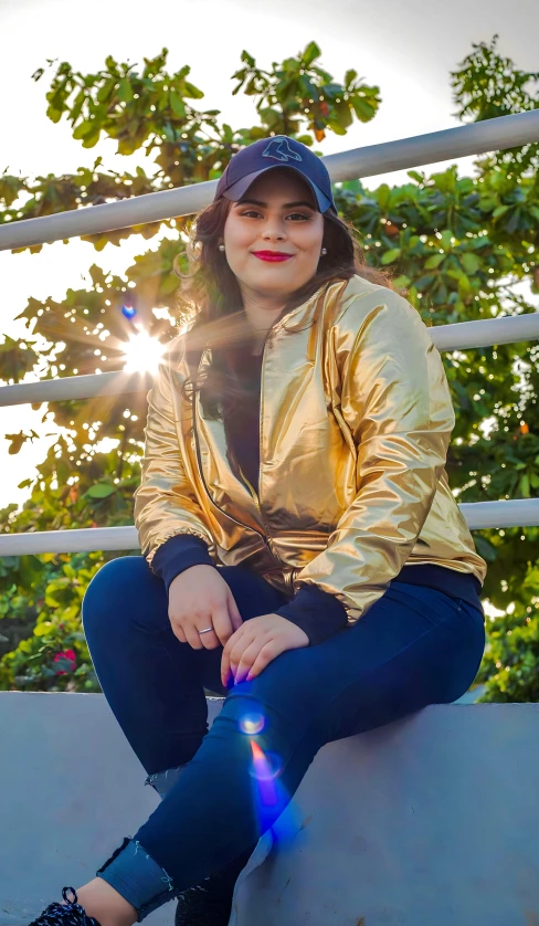 a girl in jeans, gold jacket and hat