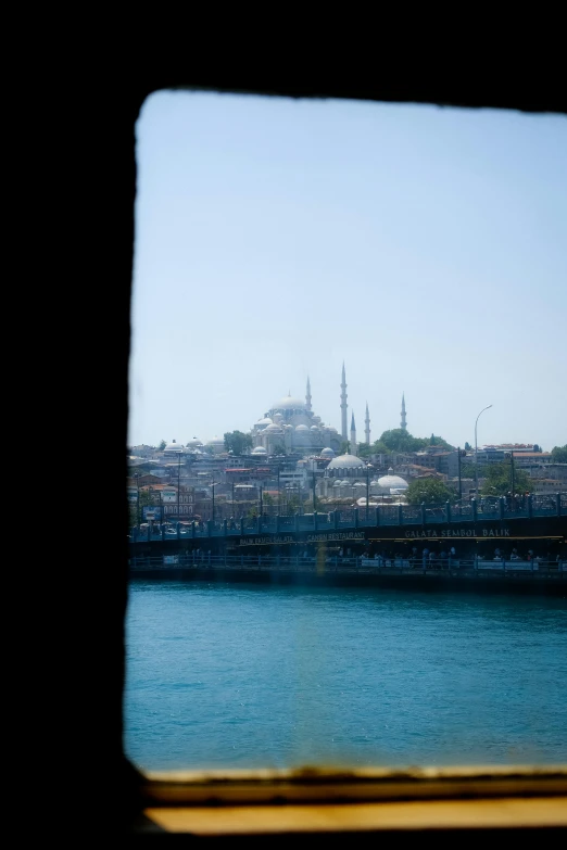 the buildings are sitting on a hill overlooking the river