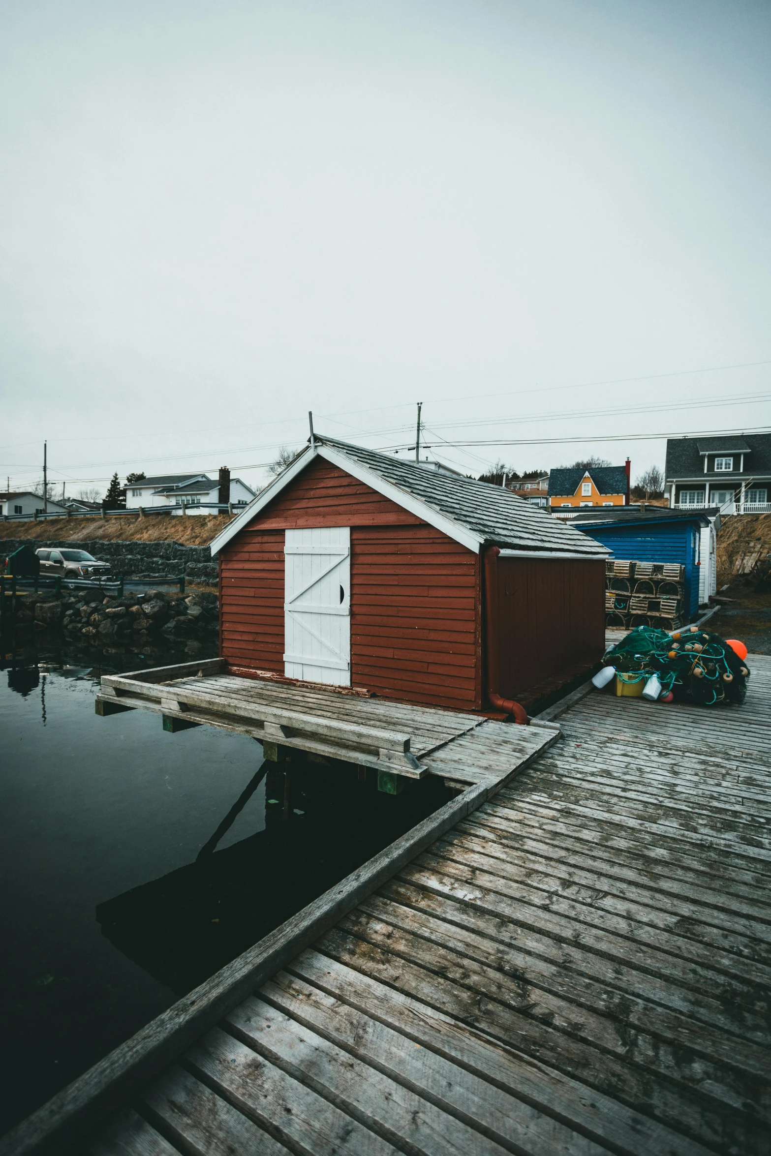 this shack sits next to a dock in the middle of a small village