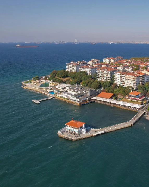 a lake surrounded by tall buildings and houses