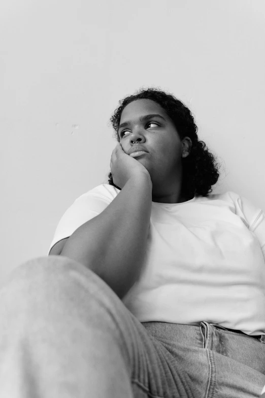 a black and white po of a woman sitting on her stomach