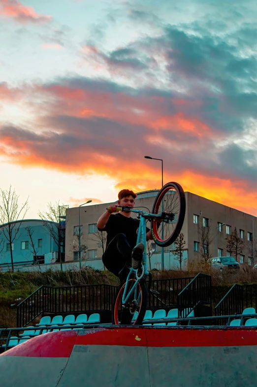 a man is performing on his bicycle ramp