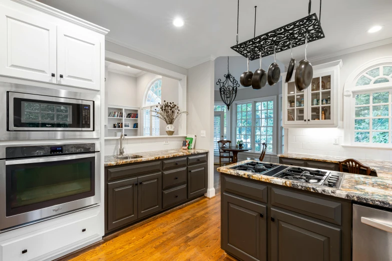 a kitchen with an island, range and dishwasher