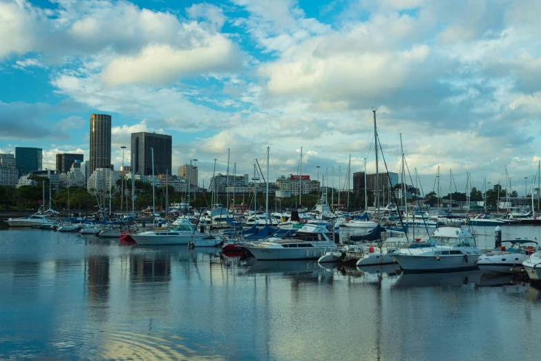 a city skyline view with many boats docked