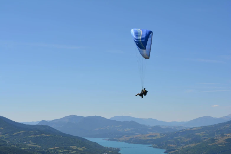 someone is on the water bundling above the mountains