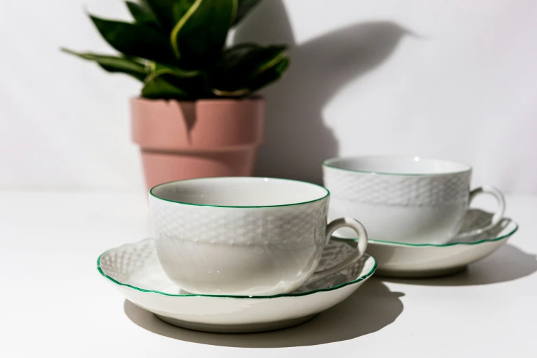 a table that has some cups and saucers on it