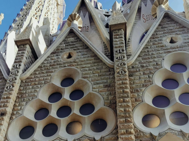 an ornate building with lots of round holes