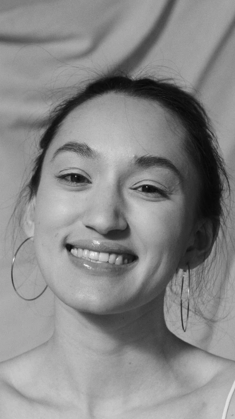 black and white pograph of smiling young woman