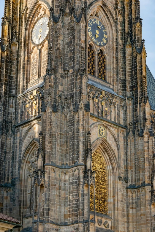 a large tower with many clocks and lights on it