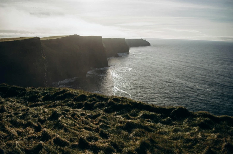 a large cliff on the coast line that goes to sea