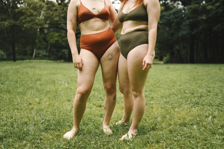 two women in matching bathing suits standing together