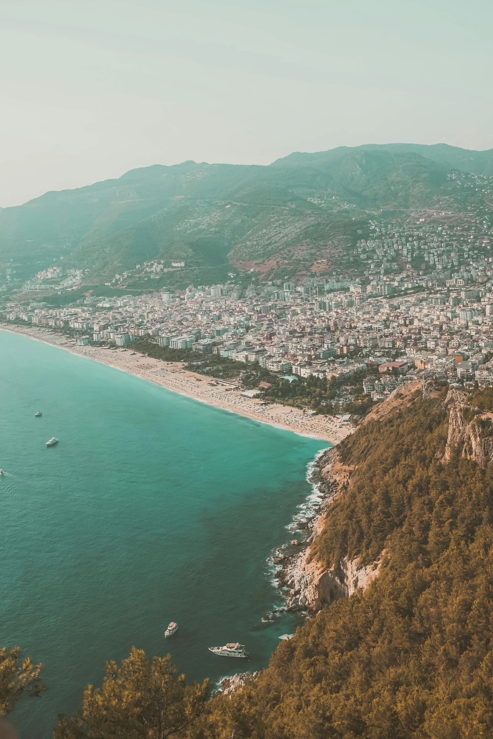 view of the beach and shore from a high cliff