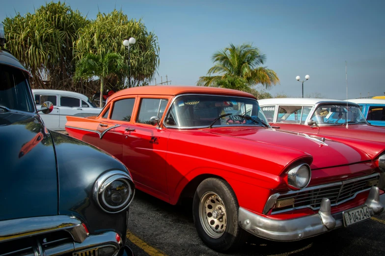 an old fashion car in a parking lot