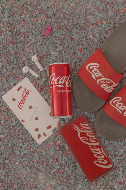 shoes and cards laying on the ground next to each other