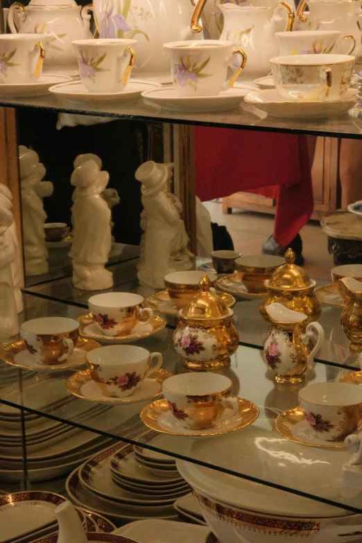 many white porcelain items are on display at a store