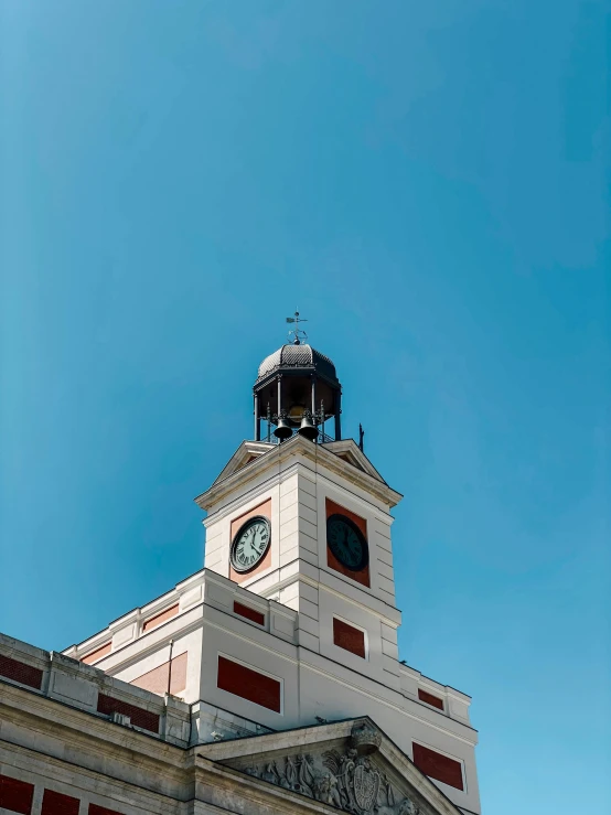 a view of the top of a building with a clock tower