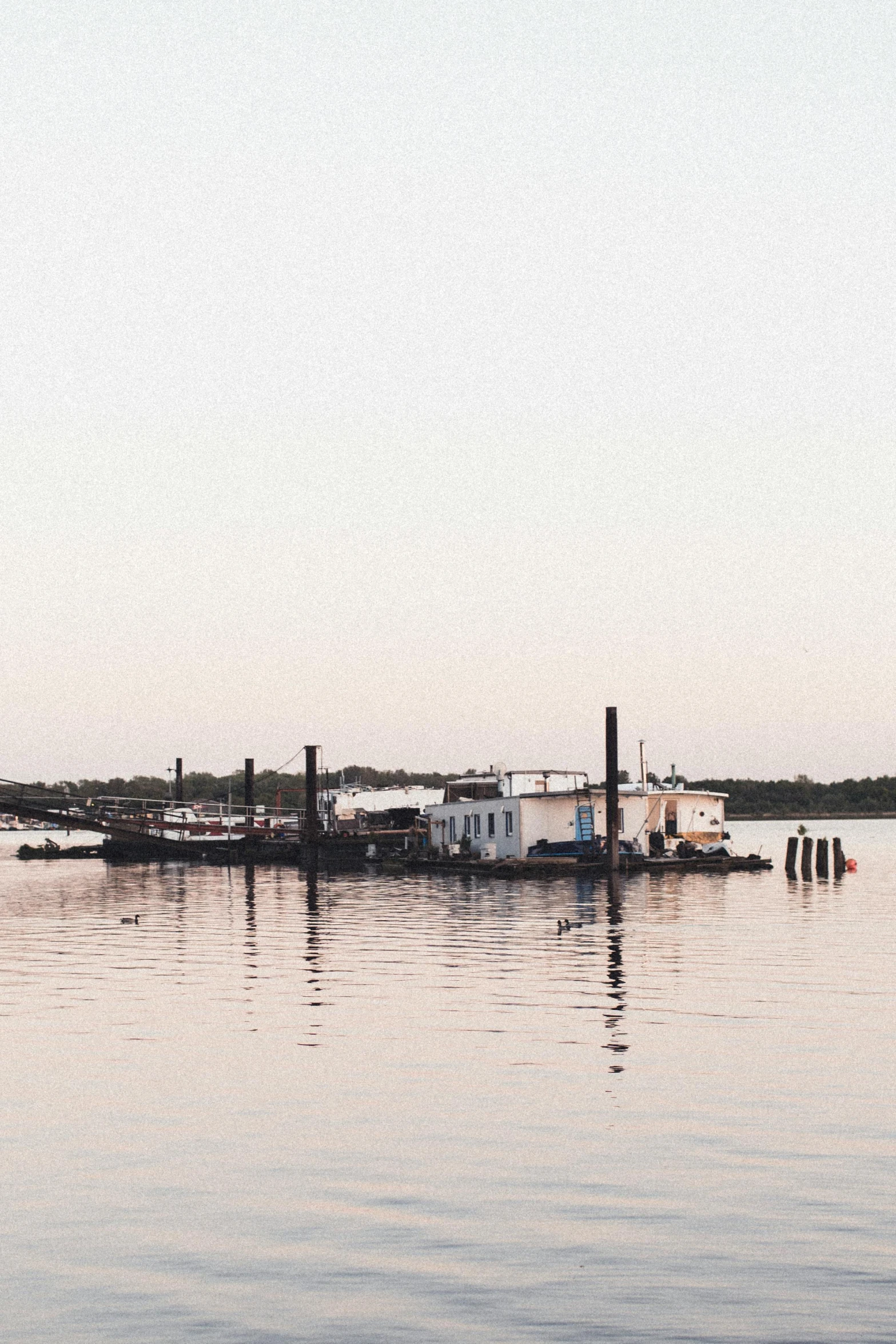 several boats are moored at the dock