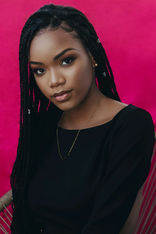 an african american woman with a crochet id hairstyle