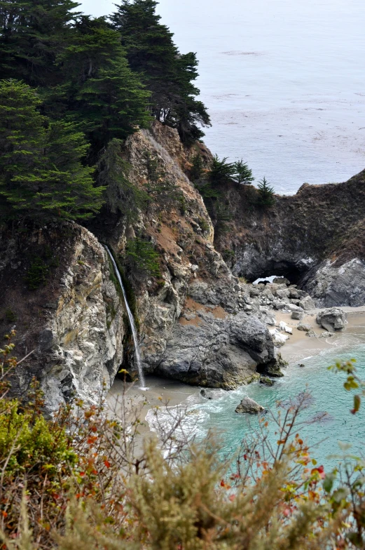 a waterfall that is coming out of the sea