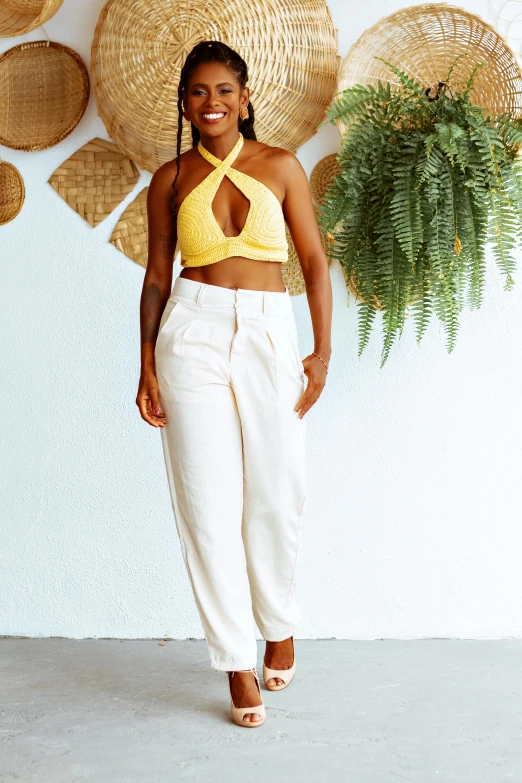 a beautiful black woman wearing yellow posing for a picture