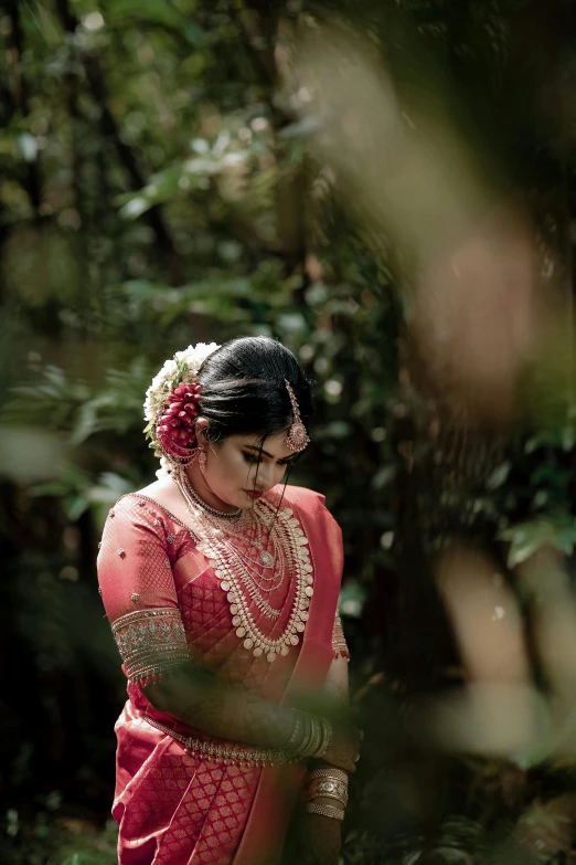 a young woman wearing red in a field