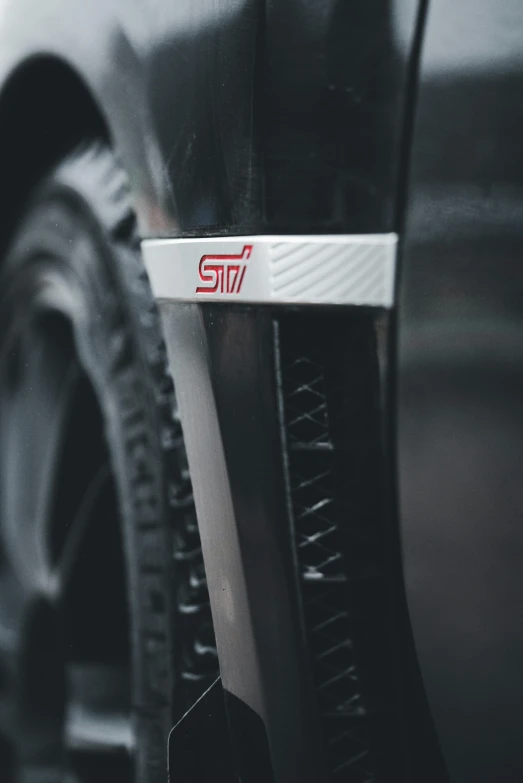 a tire on a car with some silver spokes