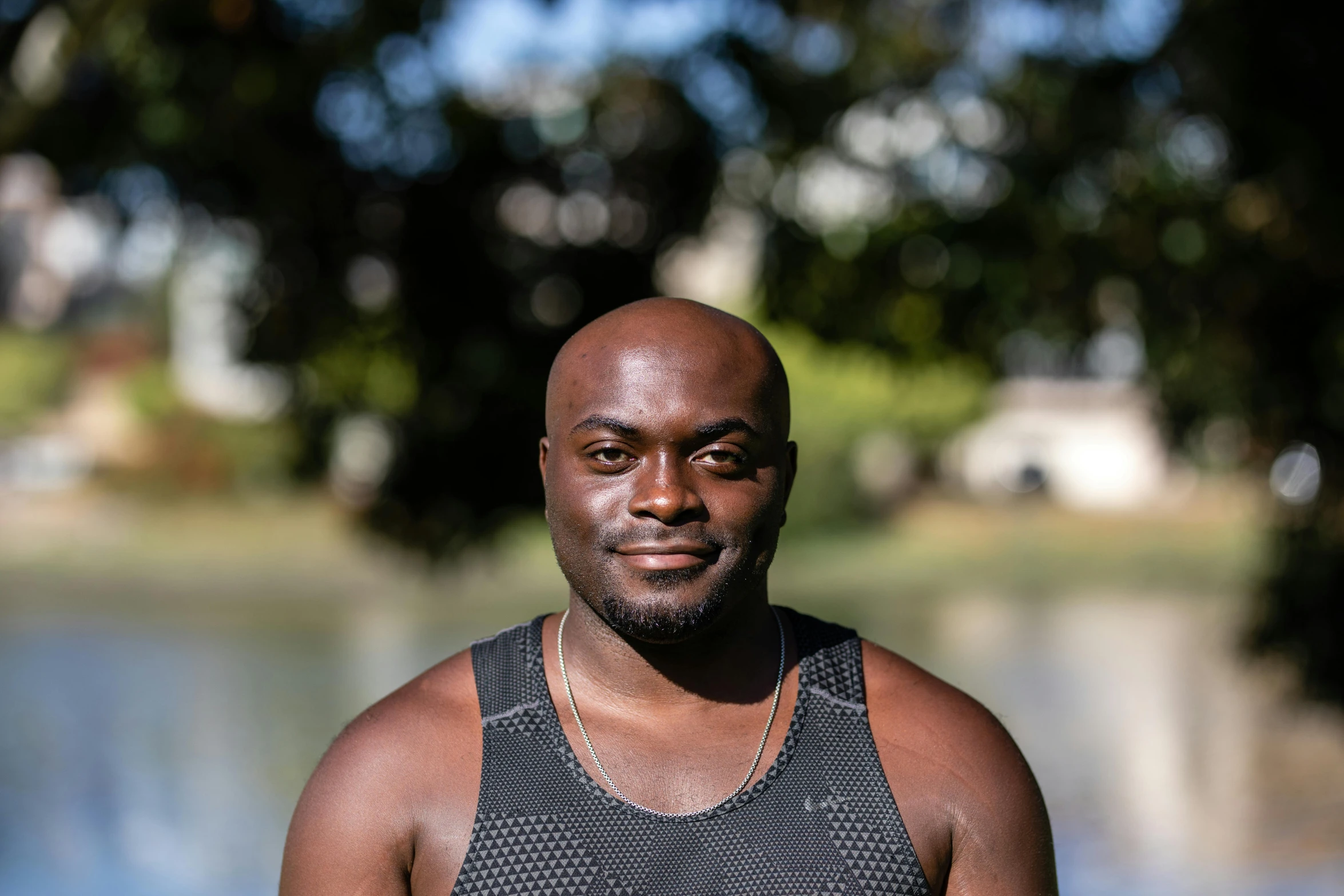 a man stands near a body of water