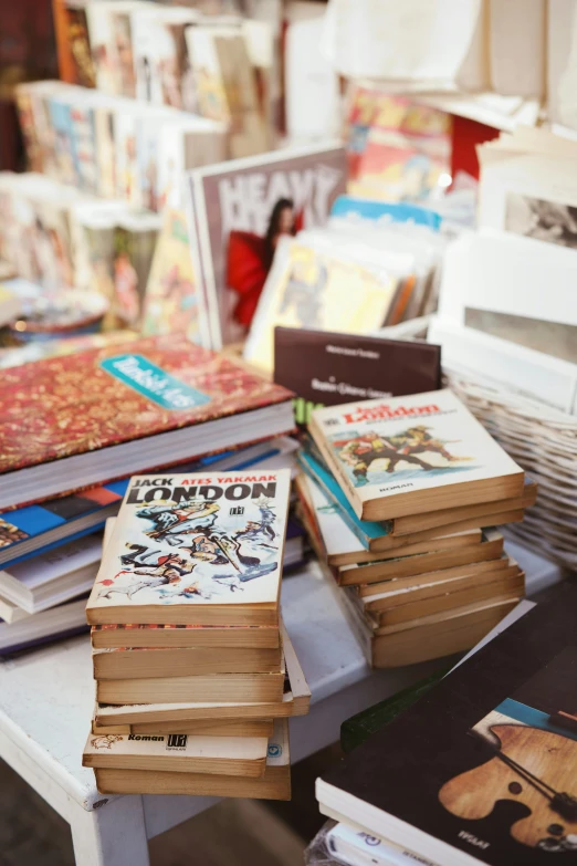 books on display at a bookstore with bookshelves behind them