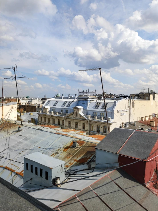 the view over rooftops to buildings from an apartment