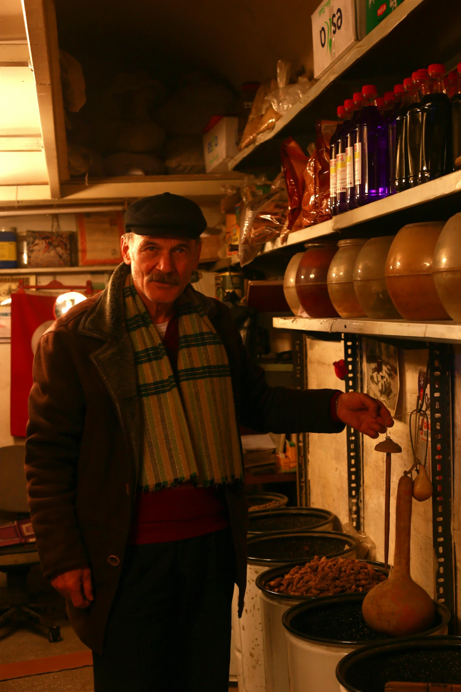 a man standing next to a bunch of food